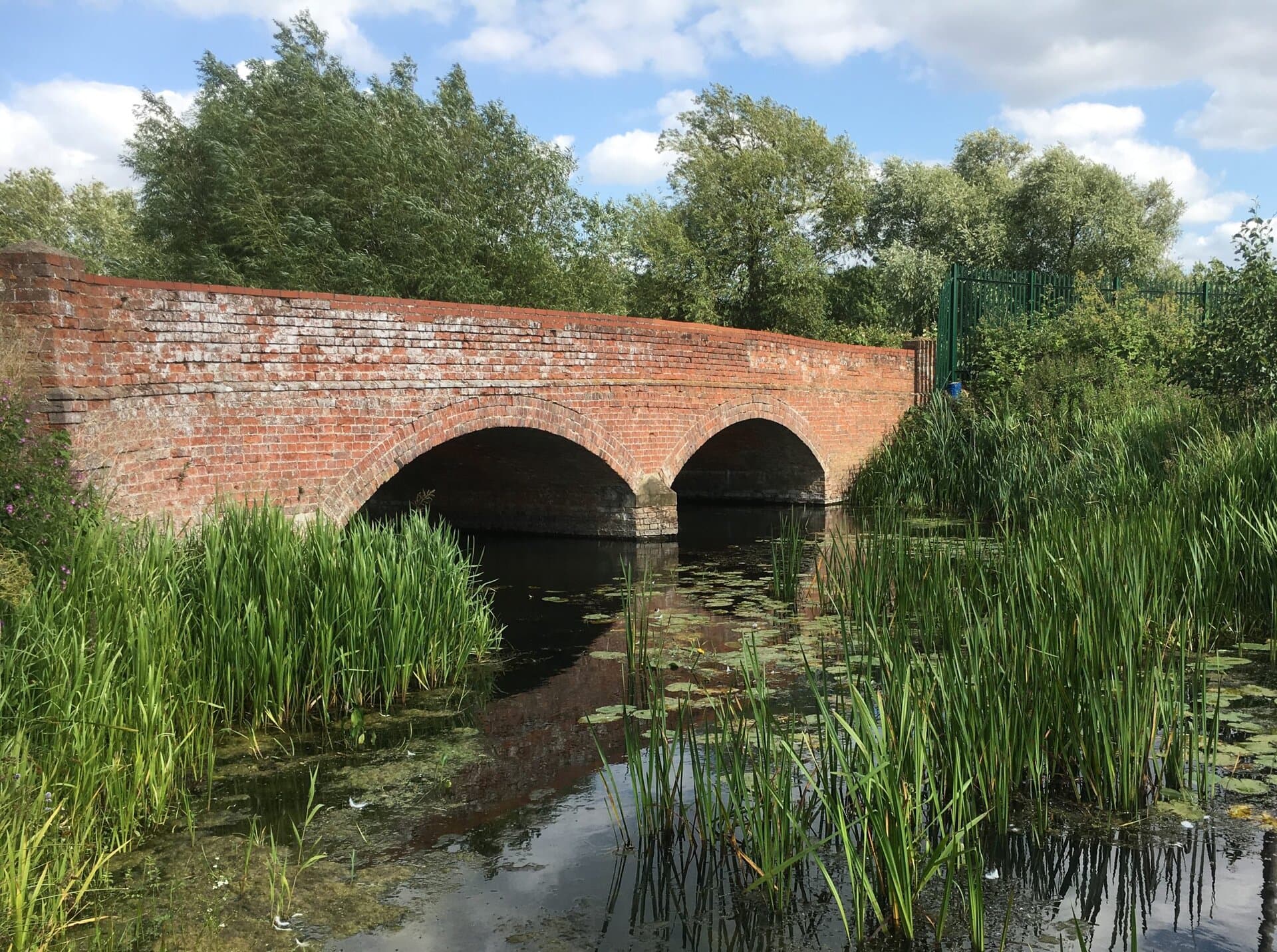Duston Mill riverbank and bridge — the outdoor venue setting